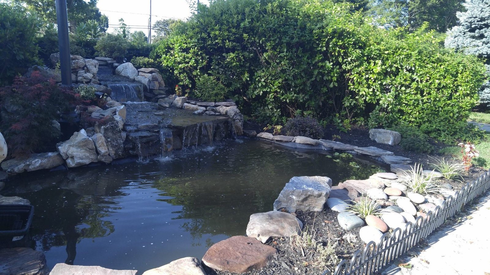 Baldwing Waterfall featuring premium landscape design in Long Island for upscale residential properties across Suffolk and Nassau County.